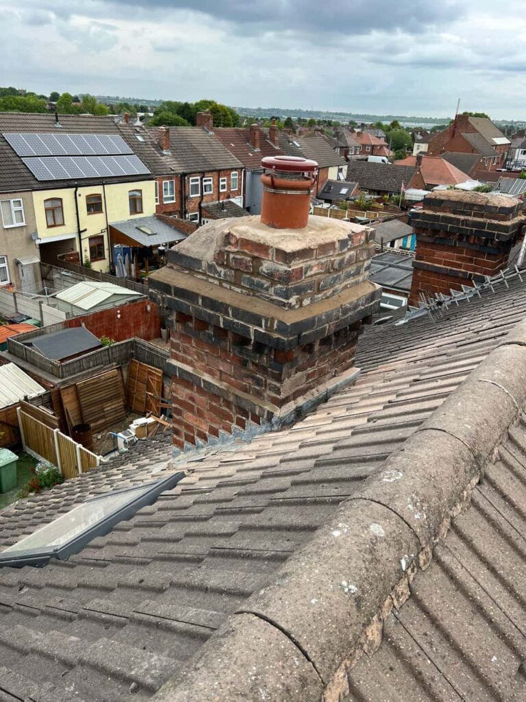 This is a photo taken from a roof which is being repaired by Knightsbridge Roofing Repairs, it shows a street of houses, and their roofs